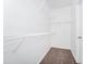 Large walk-in closet with metal shelving and carpeting; ready for organization at 911 N Orange Ave # 541, Orlando, FL 32801