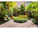 Lush courtyard of the condo complex with mature landscaping and walkways at 911 N Orange Ave # 541, Orlando, FL 32801