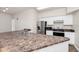Spacious kitchen with stainless steel appliances, granite countertops, and ample counter space at 911 N Orange Ave # 541, Orlando, FL 32801