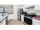 Modern kitchen boasts stainless steel appliances, sleek countertops, and ample cabinet space at 911 N Orange Ave # 541, Orlando, FL 32801