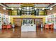Bright lobby with bookshelves, wood floors, barn doors, front desks and seating at 911 N Orange Ave # 541, Orlando, FL 32801