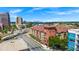 View of the condo building, the surrounding street, and nearby buildings at 911 N Orange Ave # 541, Orlando, FL 32801