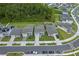 Aerial view of homes showcasing well-maintained yards and tree-lined streets in a Gathering-friendly neighborhood at 9763 Brown Burrow St, Orlando, FL 32829
