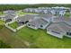 A spacious backyard featuring a covered patio and well-maintained lawn, perfect for outdoor relaxation and entertainment at 9763 Brown Burrow St, Orlando, FL 32829