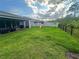 Enjoy the view from this spacious, fully fenced backyard with covered lanai and play area at 9763 Brown Burrow St, Orlando, FL 32829