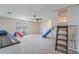 Spacious bonus room features a cozy play area with a slide and built-in ladder for added fun at 9763 Brown Burrow St, Orlando, FL 32829