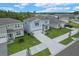 Charming two-story home featuring a two car garage, lush landscaping, and a well-manicured lawn at 9763 Brown Burrow St, Orlando, FL 32829