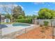 The in-ground pool and spa are surrounded by lush landscaping and privacy fencing at 610 Palomas Ave, Ocoee, FL 34761