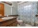 Bathroom showcasing wood vanity with floral shower curtain at 610 Palomas Ave, Ocoee, FL 34761