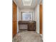 Bathroom featuring wood vanity, single sink, skylight, and view to the bedroom at 610 Palomas Ave, Ocoee, FL 34761