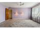 Large bedroom with open door and decorative lighting at 610 Palomas Ave, Ocoee, FL 34761