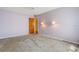 Comfortable bedroom with purple walls and decorative sconce lighting at 610 Palomas Ave, Ocoee, FL 34761