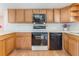 Efficient kitchen features modern appliances, ample counter space and wood cabinetry at 610 Palomas Ave, Ocoee, FL 34761