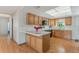 Charming kitchen with wood cabinets, modern appliances, and breakfast bar perfect for casual dining at 610 Palomas Ave, Ocoee, FL 34761