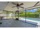 Spacious screened lanai features a ceiling fan and a view of the pool and backyard at 610 Palomas Ave, Ocoee, FL 34761