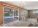 Living room with sliding glass doors that lead to a screened-in pool area at 610 Palomas Ave, Ocoee, FL 34761