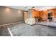 Spacious living room with unique wood paneling, carpeted floor and comfortable seating at 610 Palomas Ave, Ocoee, FL 34761