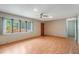 Bright living room featuring hardwood floors and a large window with backyard views at 610 Palomas Ave, Ocoee, FL 34761