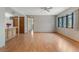 Open-concept living area with hardwood floors connecting to the kitchen at 610 Palomas Ave, Ocoee, FL 34761