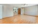 Open-concept living area with hardwood floors connecting to the kitchen at 610 Palomas Ave, Ocoee, FL 34761