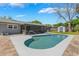 This backyard features a screened in lanai, in-ground pool, and a cozy spa at 610 Palomas Ave, Ocoee, FL 34761