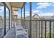 Balcony with seating overlooks a resort building under a blue sky at 14501 Grove Resort Ave # 3735, Winter Garden, FL 34787