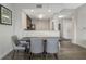 A well-lit dining area adjacent to the kitchen features modern furnishings and an open concept design at 14501 Grove Resort Ave # 3735, Winter Garden, FL 34787