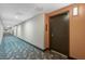 Condo hallway with colorful carpets and building room numbers at 14501 Grove Resort Ave # 3735, Winter Garden, FL 34787