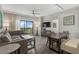 Cozy living room with balcony access, a dining area, and an open layout perfect for entertaining at 14501 Grove Resort Ave # 3735, Winter Garden, FL 34787