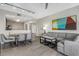 An open concept living space featuring dining area, comfortable seating, and a modern aesthetic at 14501 Grove Resort Ave # 3735, Winter Garden, FL 34787