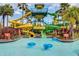 Exciting waterpark area with colorful slides, a tower, and a lazy river at 14501 Grove Resort Ave # 3735, Winter Garden, FL 34787