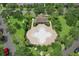 Aerial view of community pool and pavilion surrounded by lush greenery and manicured grounds at 14717 Royal Poinciana Dr, Orlando, FL 32828