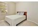 Cozy bedroom featuring a window letting in natural light and neutral carpet flooring at 14717 Royal Poinciana Dr, Orlando, FL 32828