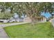 Charming home with a well-maintained lawn and mature trees in a desirable neighborhood at 14717 Royal Poinciana Dr, Orlando, FL 32828