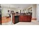 Open kitchen view with breakfast bar, modern appliances, and seamless flow to living spaces at 14717 Royal Poinciana Dr, Orlando, FL 32828