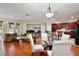 Open-concept living area flowing into a kitchen with wooden cabinets and a black refrigerator at 14717 Royal Poinciana Dr, Orlando, FL 32828