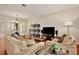 Inviting living room with wood floors, comfortable seating, and stylish decor at 14717 Royal Poinciana Dr, Orlando, FL 32828