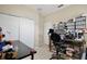 Home office featuring a sliding door closet and carpet flooring at 14717 Royal Poinciana Dr, Orlando, FL 32828