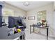 Home office featuring carpet flooring and natural light at 14717 Royal Poinciana Dr, Orlando, FL 32828