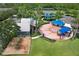 Aerial shot of community playground with splash pad, playground equipment, and picnic areas under shaded canopies at 14717 Royal Poinciana Dr, Orlando, FL 32828
