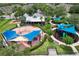 Community playground with shade structures, picnic tables, and play equipment surrounded by lush landscaping at 14717 Royal Poinciana Dr, Orlando, FL 32828
