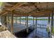Beautiful lake view from the dock, enhanced by a charming gazebo with a swing at 18618 Lake Pickett Rd, Orlando, FL 32820