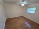 Cozy bedroom with wood flooring, bright window, and closet, ideal for a peaceful retreat at 217 Longleaf Ct, Orlando, FL 32835