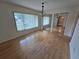 Bright dining room boasts gleaming hardwood floors, natural light, and sliding mirrored closet doors at 217 Longleaf Ct, Orlando, FL 32835