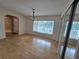 Sunny dining room featuring gleaming hardwood floors, mirrored closets and lots of light at 217 Longleaf Ct, Orlando, FL 32835