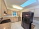 Bright kitchen with stainless steel appliances and granite countertops with neutral-toned cabinetry at 217 Longleaf Ct, Orlando, FL 32835