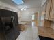 Cozy kitchen with stainless steel appliances, granite countertops, tile floors, and breakfast bar at 217 Longleaf Ct, Orlando, FL 32835
