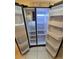 Side-by-side refrigerator with open doors showing shelving for food storage at 217 Longleaf Ct, Orlando, FL 32835