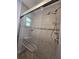 Modern shower with tiled walls and glass door at 217 Longleaf Ct, Orlando, FL 32835