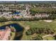 Expansive aerial view of a community with a golf course and numerous residential homes at 5813 Parkview Point Dr, Orlando, FL 32821